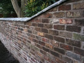 AFTER THIS UNSAFE AND UNSIGHTLY WALL HAS BEEN REBUILT, BY CLEANING THE OLD BRICK AND RELAYING WITH THE BROCKSTONE PRECISION CRESSINGTON PARK