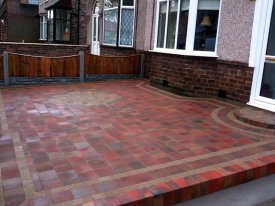 AFTER USING TOBERMORE SHANNON BLOCK PAVING IN HEATHER WITH A PERFECT CIRCULAR FEATURE ENHANCES THE OVERALL LOOK OF THIS  FAMILY HOME  IN GARSTON